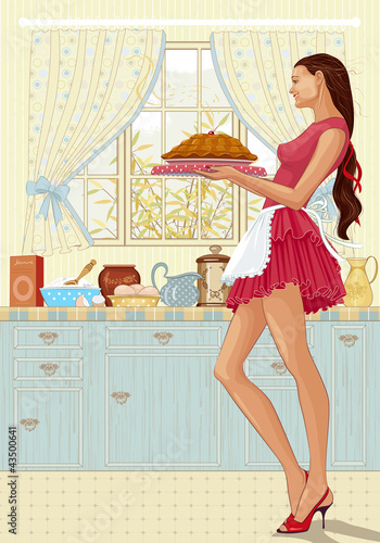 Woman holding a tray of freshly baked cake in the kitchen