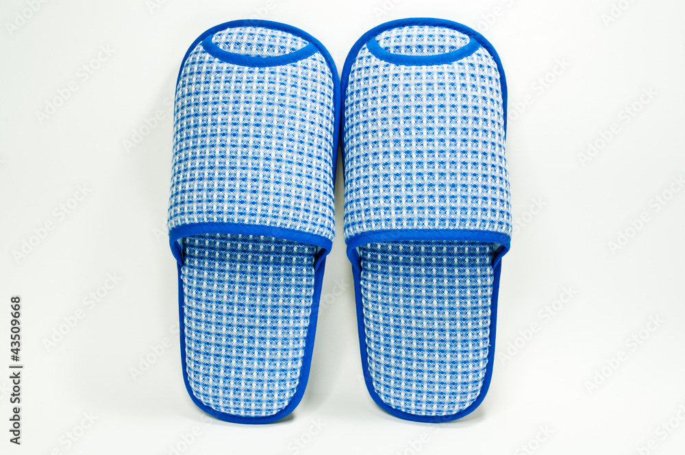 Pair of house slippers with reflection on white background Pair of house slippers with reflection on white background