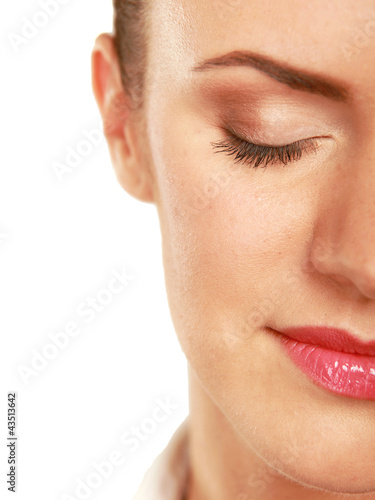 A half of a beautiful female's face, closeup, isolated on white