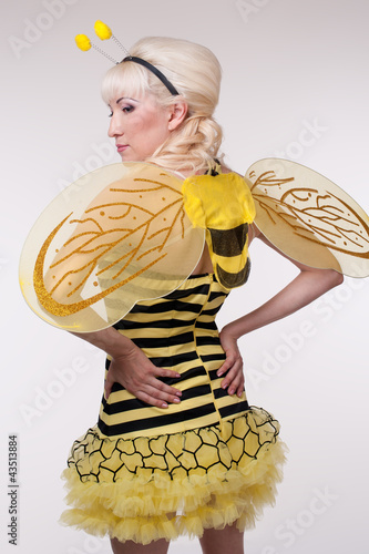 Young woman in the bee costumes