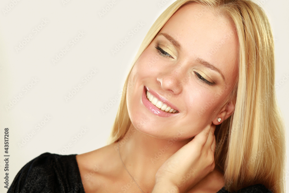 Young woman touching her neck isolated on whire background Young woman touching her neck isolated on whire background