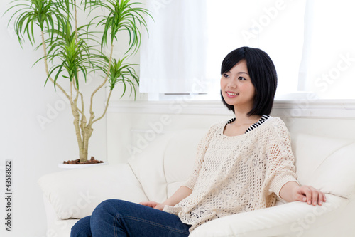 a young asian woman relaxing