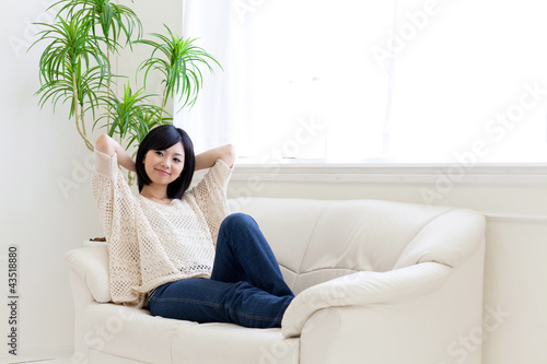 a young asian woman relaxing