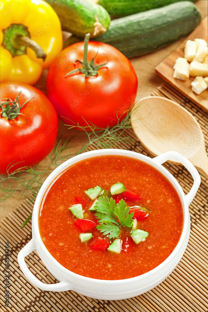 Gazpacho and ingredients on a table, vegetable soup Gazpacho and ingredients on a table, vegetable soup