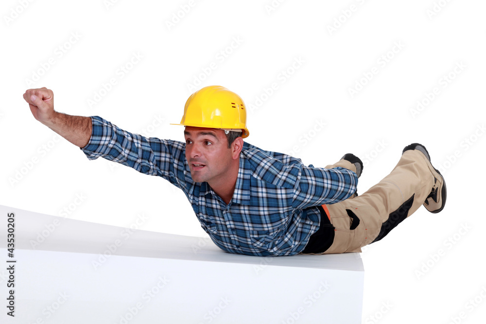 Manual worker in superman pose Manual worker in superman pose