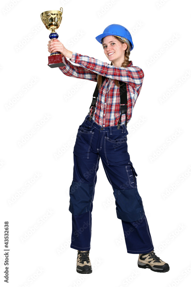 Female construction worker with a gold cup Female construction worker with a gold cup