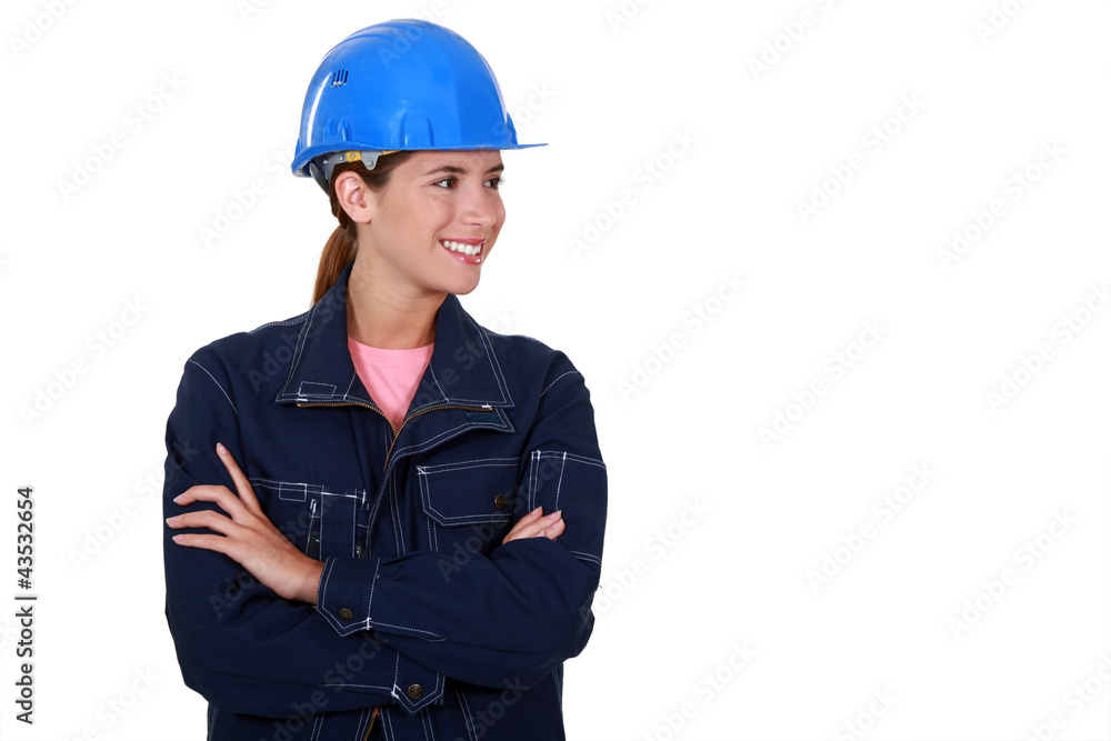 Female builder stood with folded arms Female builder stood with folded arms