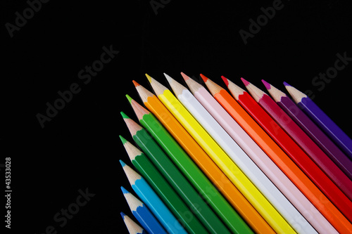 Colorful pencils on black background