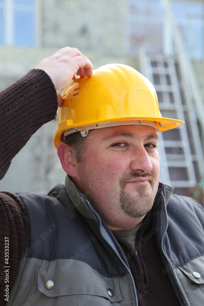 Builder scratching his head Builder scratching his head