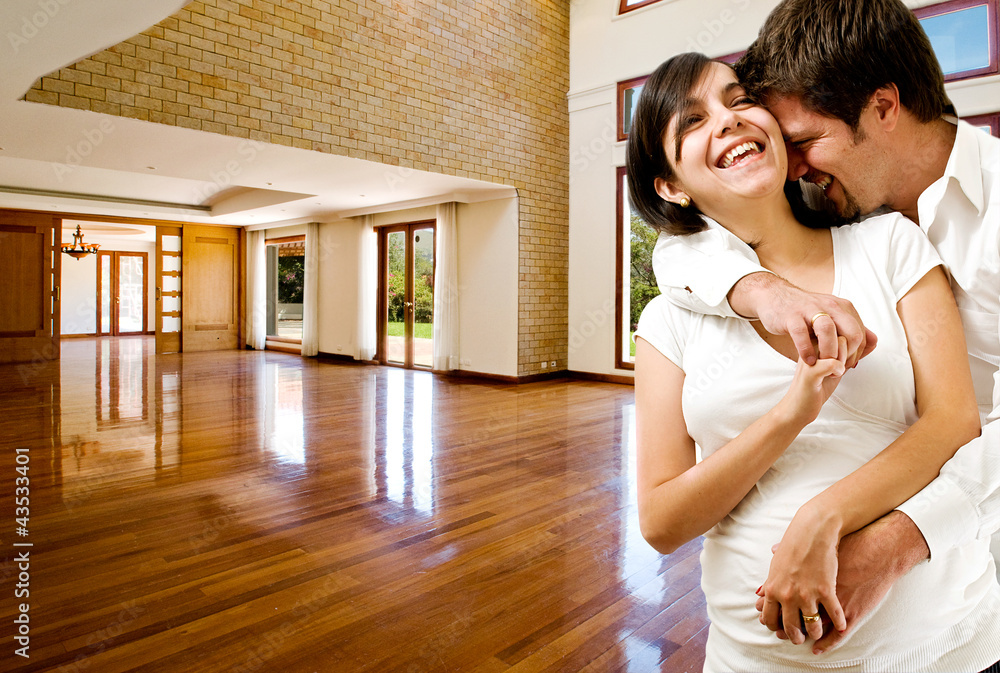 Young happly couple at their new house Young happly couple at their new house