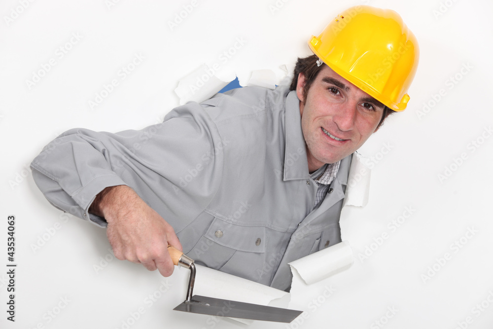 A mason with a trowel. A mason with a trowel.
