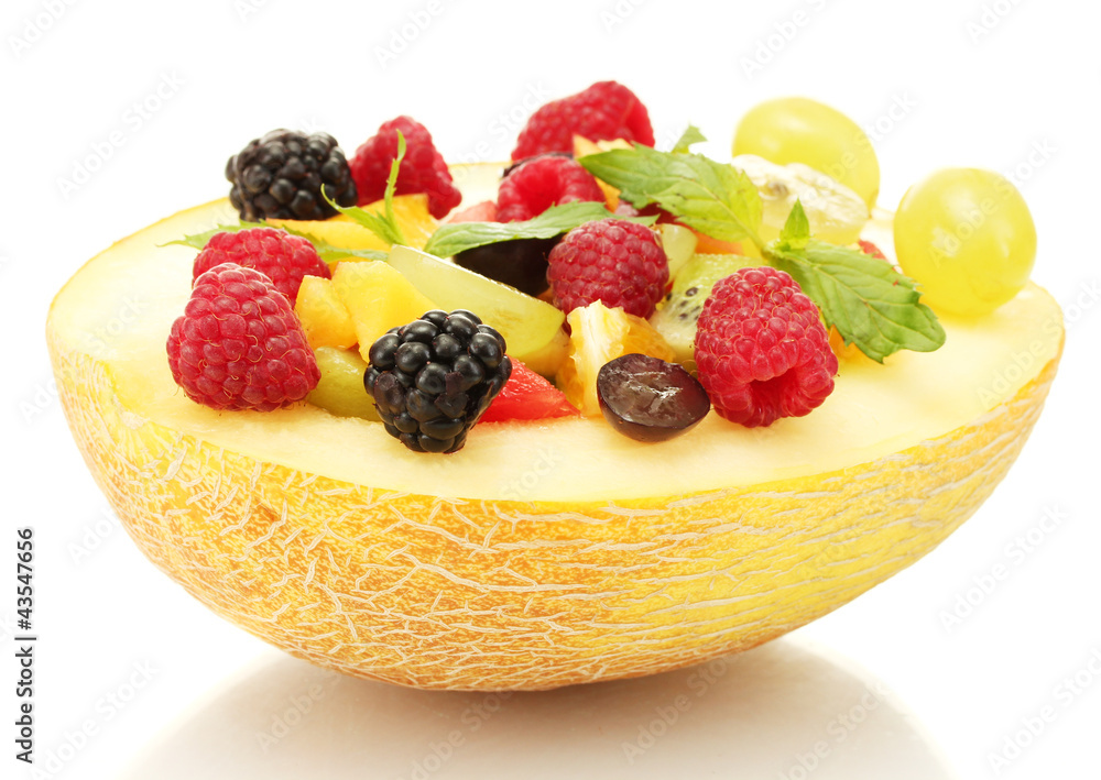 fresh fruits salad in melon, isolated on white fresh fruits salad in melon, isolated on white