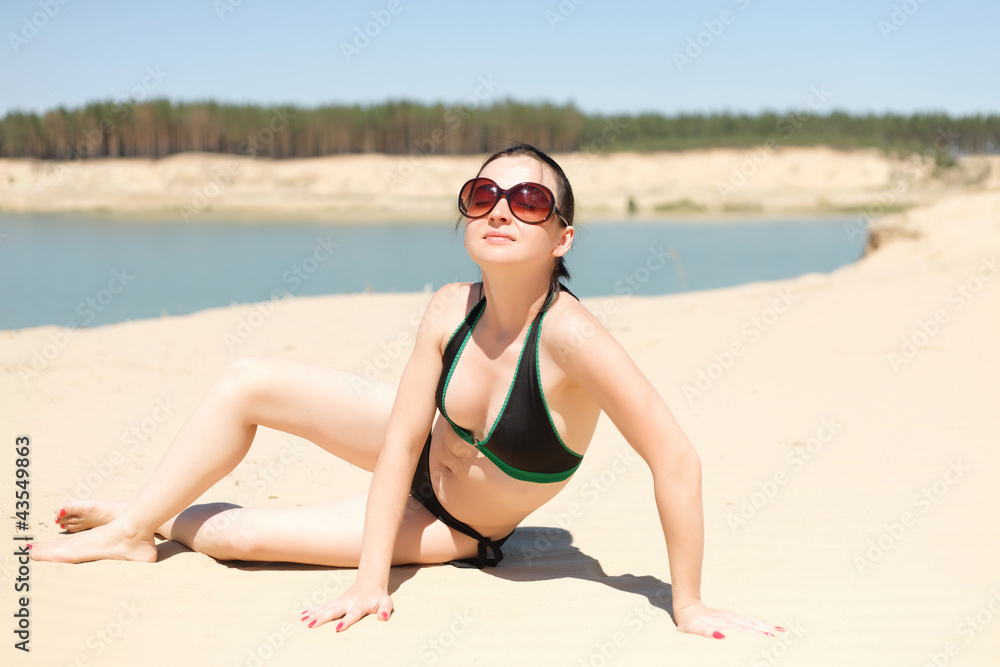 Fototapeta premium Brunette in glasses tans