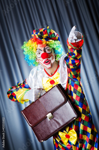 Clown with business briefcase