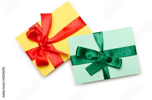 Envelope with colourful ribbon on white
