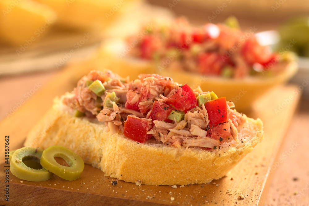 Baguette with tuna, green olive and tomato spread Baguette with tuna, green olive and tomato spread