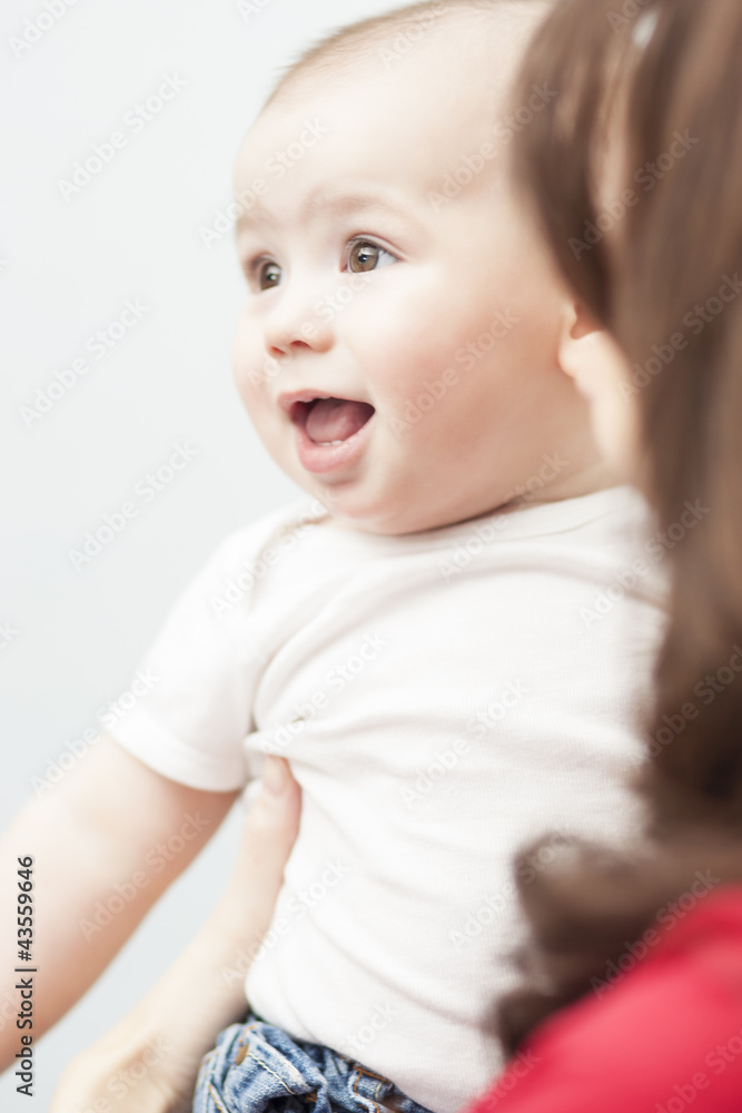 infant on mather's hands infant on mather's hands