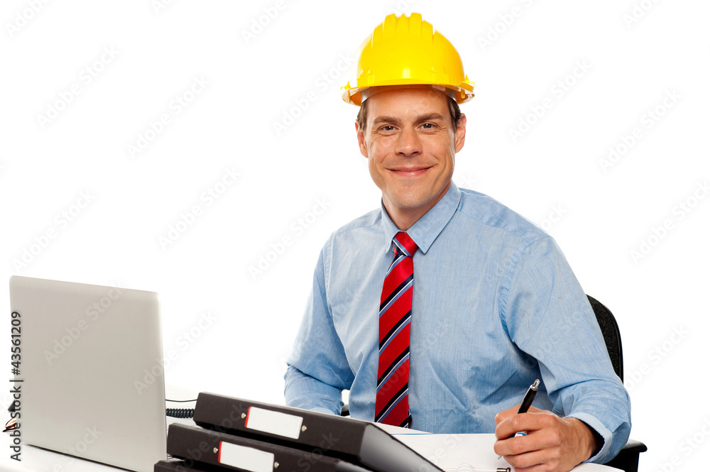 Portrait of handsome architect writing notes Portrait of handsome architect writing notes