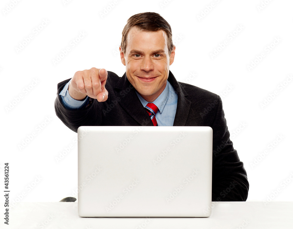 Handsome male executive pointing at you Handsome male executive pointing at you