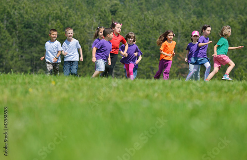 happy kids group have fun in nature