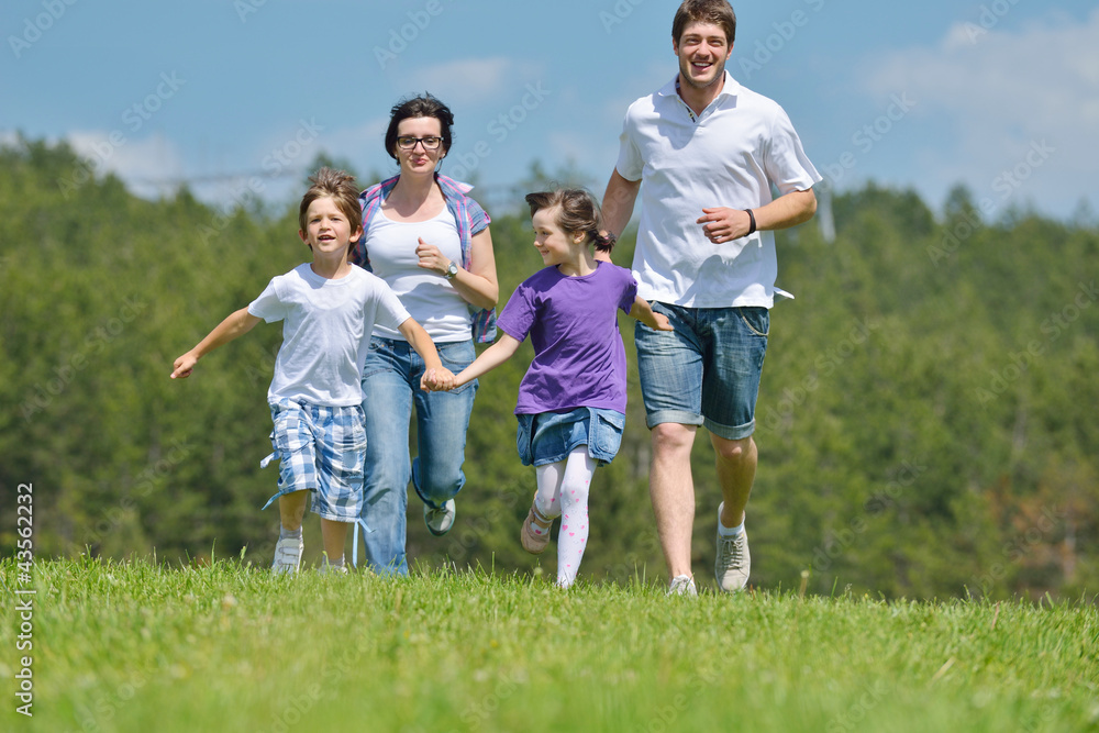 happy young family have fun outdoors happy young family have fun outdoors