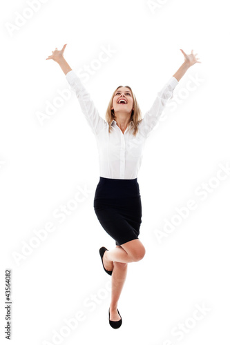 Pretty young woman with arms raised isolated