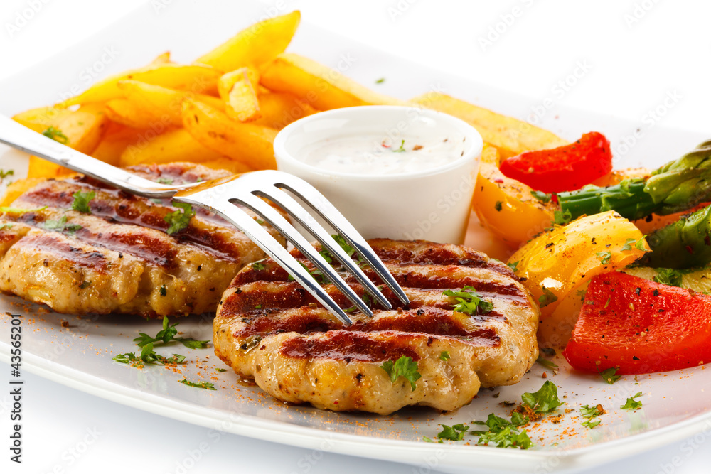 Grilled steak, French fries and vegetables Grilled steak, French fries and vegetables