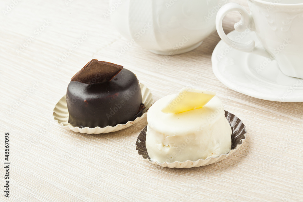 chocolate pastry little cake with tea cup on wooden table chocolate pastry little cake with tea cup on wooden table