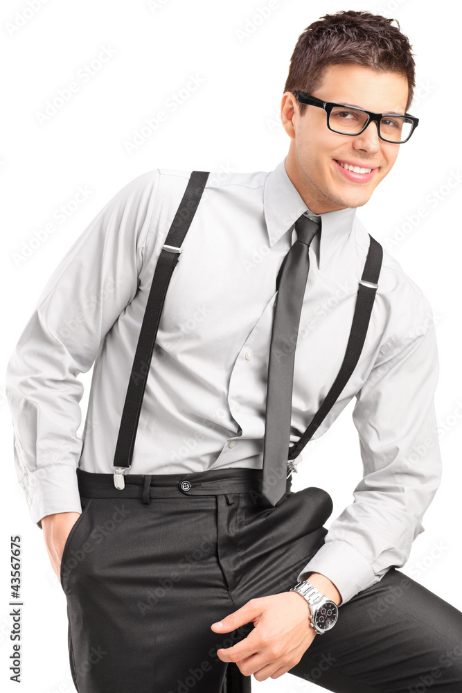 Fototapeta premium A young handsome male sitting on a chair