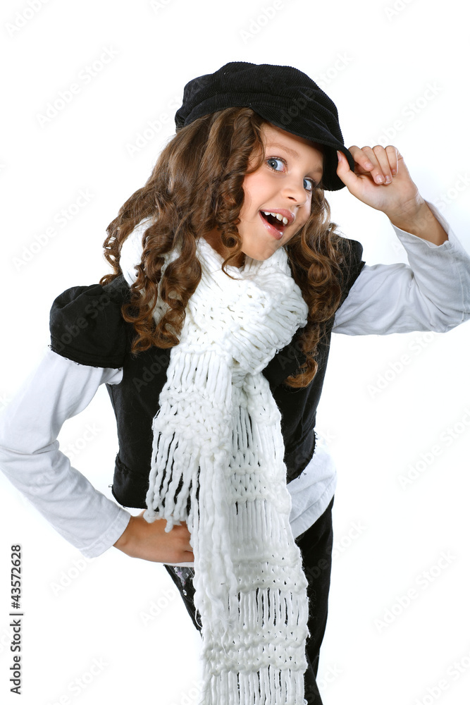 A little beautiful girl is in autumn clothes on a white A little beautiful girl is in autumn clothes on a white
