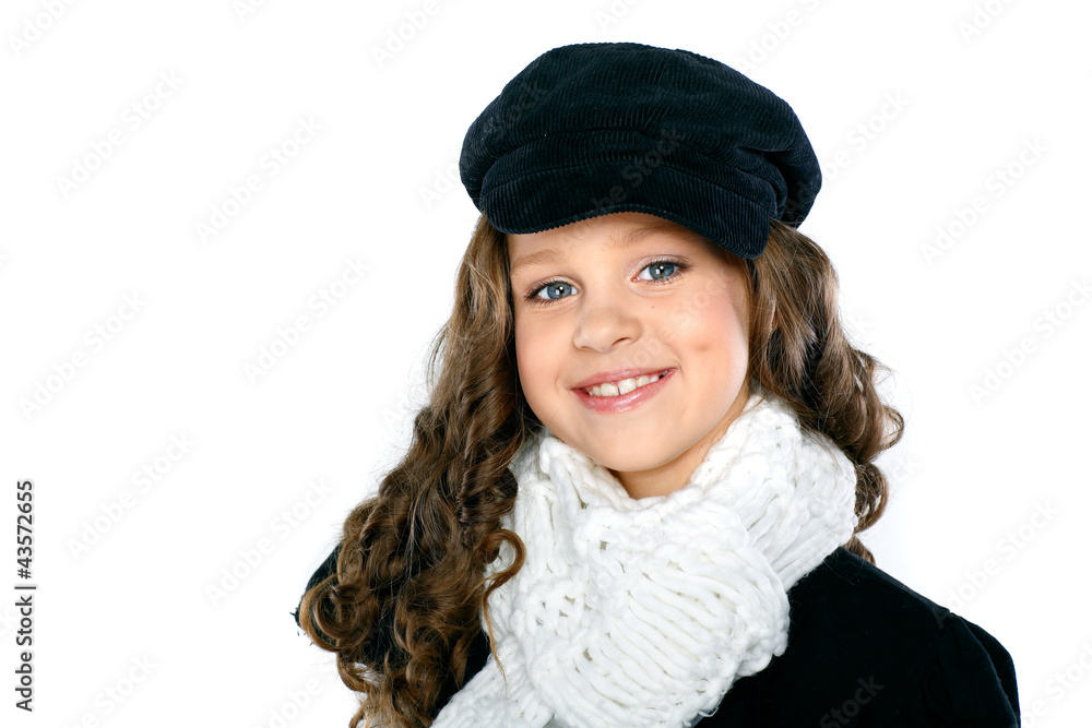 A little beautiful girl is in autumn clothes on a white A little beautiful girl is in autumn clothes on a white