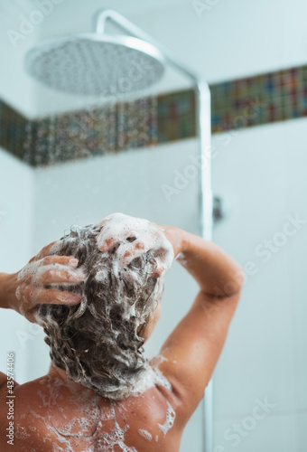 Portrait of relaxed woman taking shower