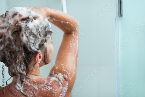 Portrait of relaxed woman taking shower