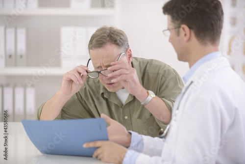 Doctor showing results to myopic patient