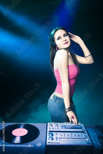Beautiful DJ girl at the club