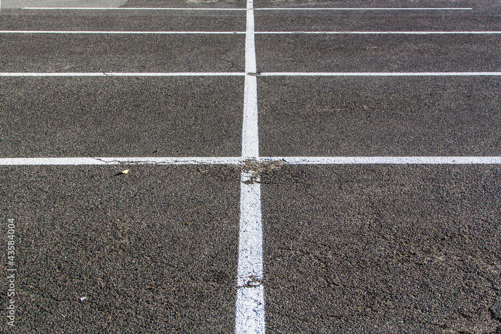 lines for parking lotzs drawn on the asphalt