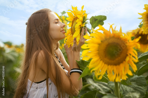 Girl and sunflowers