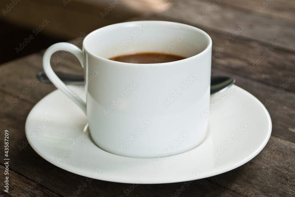 Coffee cup on the wood texture background. Coffee cup on the wood texture background.