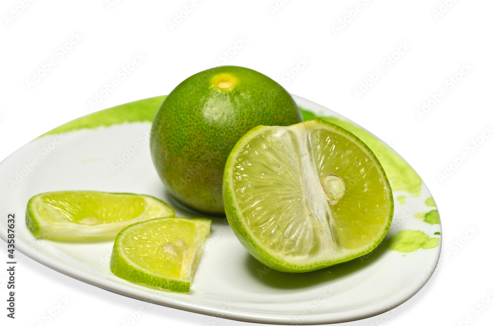 Fresh lime green. Isolated on a white background. Fresh lime green. Isolated on a white background.