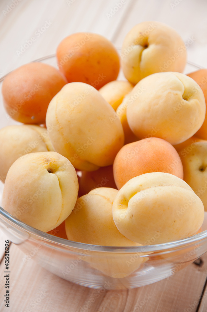 Glass bowl with ripe apricots, close-up Glass bowl with ripe apricots, close-up