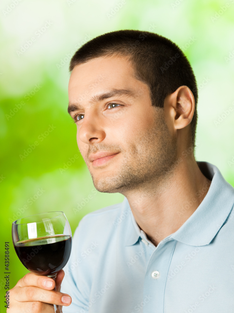 Thinking man with redwine, outdoors Thinking man with redwine, outdoors