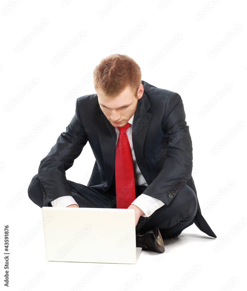 Portrait of a happy young businessman working on laptop Portrait of a happy young businessman working on laptop