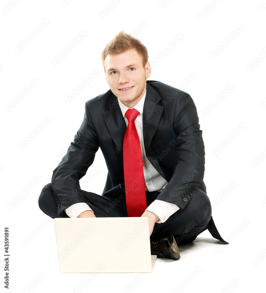 Portrait of a happy young businessman working on laptop Portrait of a happy young businessman working on laptop