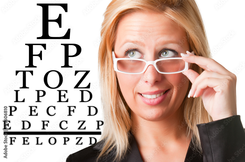 Wondering Businesswoman Looking at an eyechart Wondering Businesswoman Looking at an eyechart