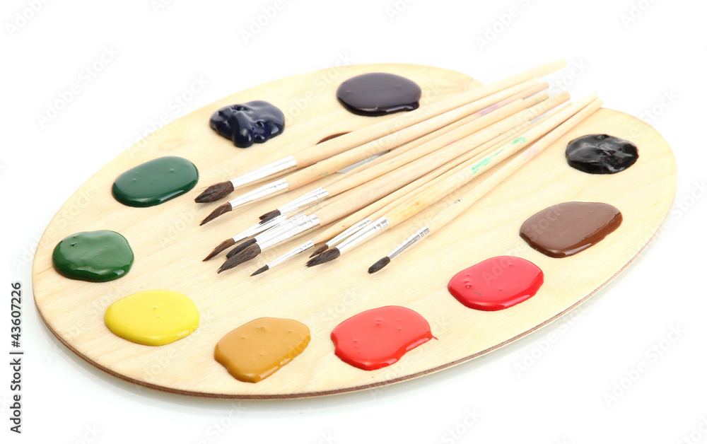 wooden art palette with paint and brushes.isolated on white wooden art palette with paint and brushes.isolated on white