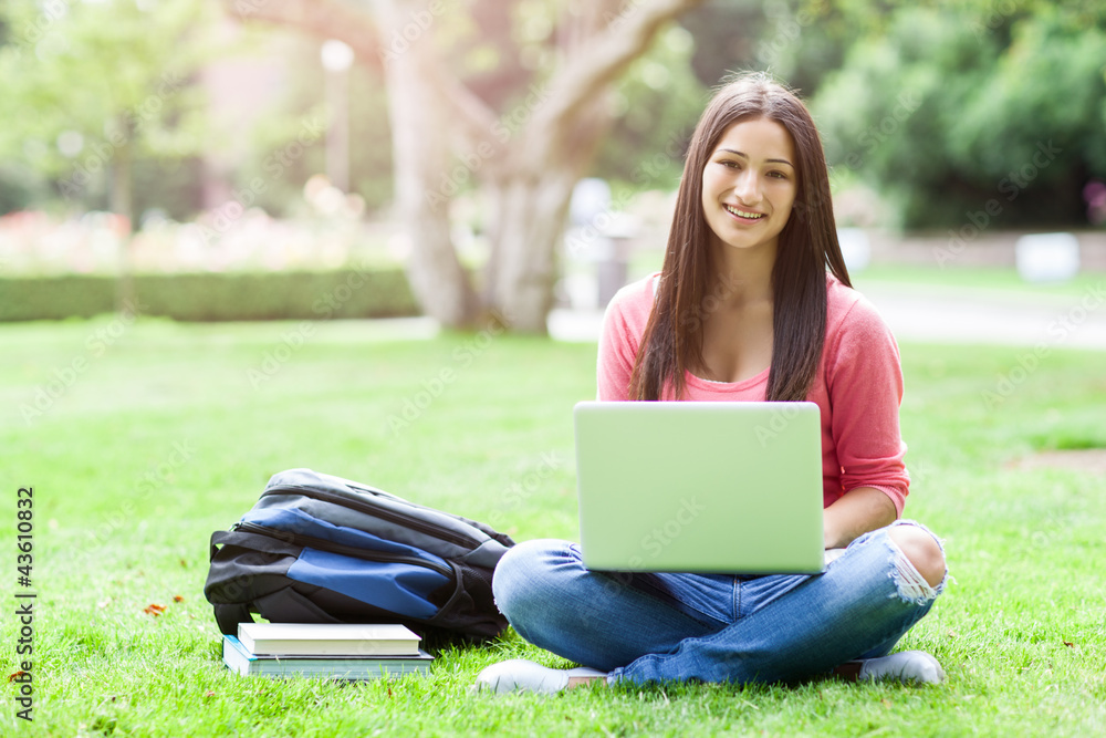 Hispanic college student with laptop Hispanic college student with laptop