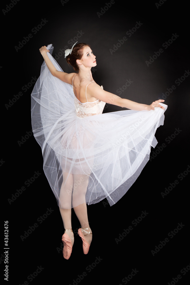 Fototapeta premium Young beautiful dancer posing on a studio