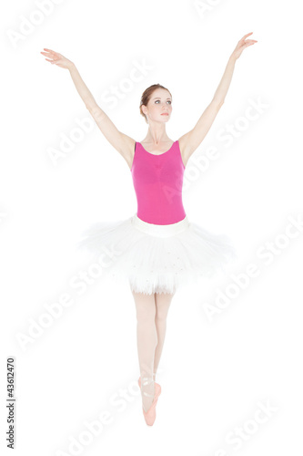Young beautiful dancer posing on a studio