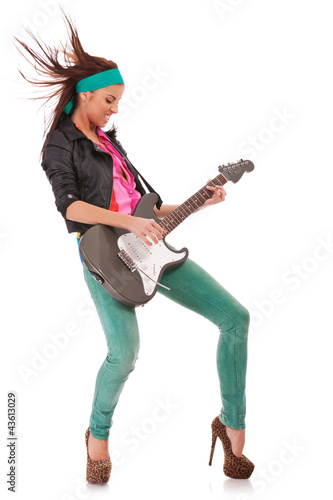 woman guitarist playing rock and roll