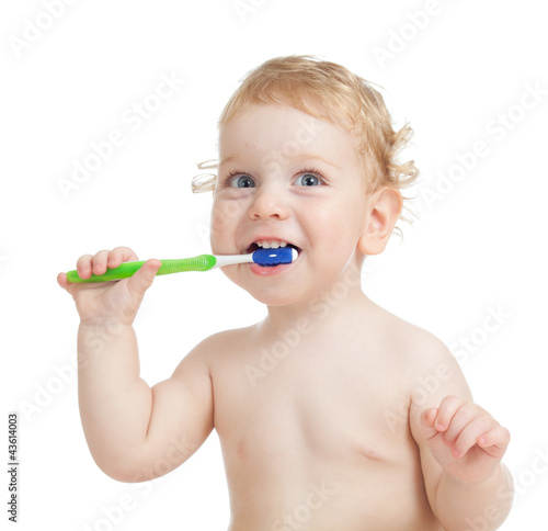 Happy child brushing teeth isolated on white